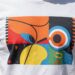T-shirt with a bold graphic design.